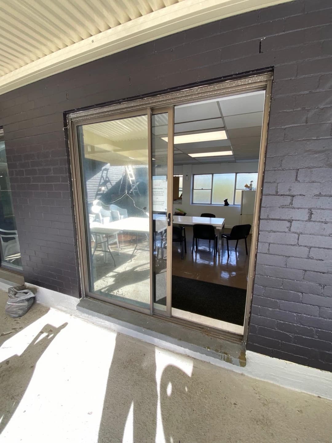 Bronze Sliding Doors, Dark Brick Community Hall