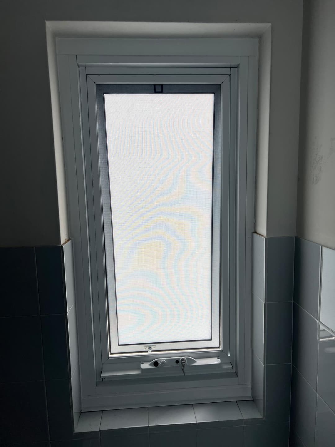 Frosted Awning Window, Blue-Grey Tile Bathroom
