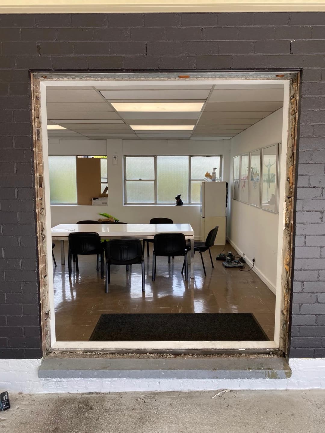 Meeting Room and Kitchen Openings Before Install, Dark Brick Hall